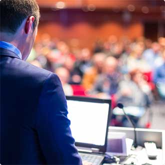 Person speaking at conference